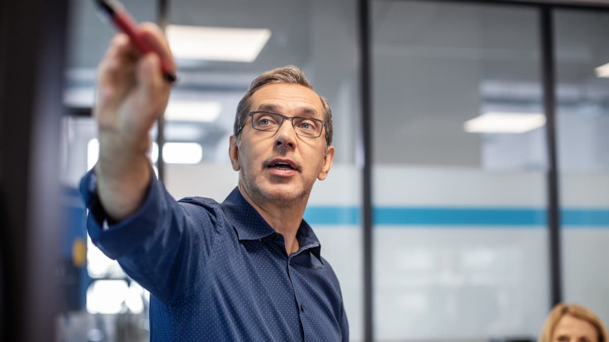 man pointing with a pen